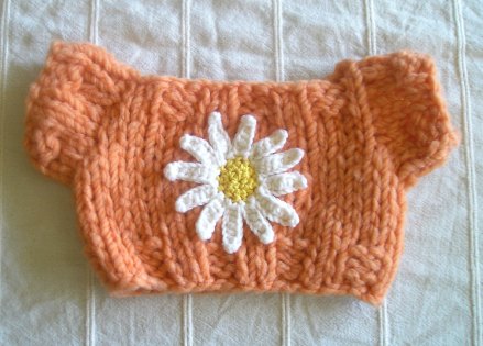 Orange Sweater with Crocheted Daisy